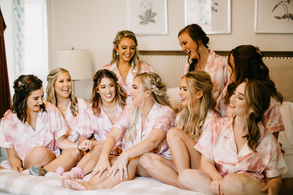 bridemaids and bride getting ready in pajamas