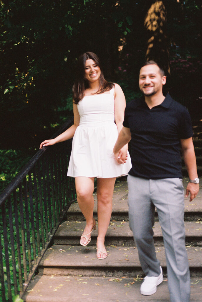 couple holding hands longwood gardens engagement photos