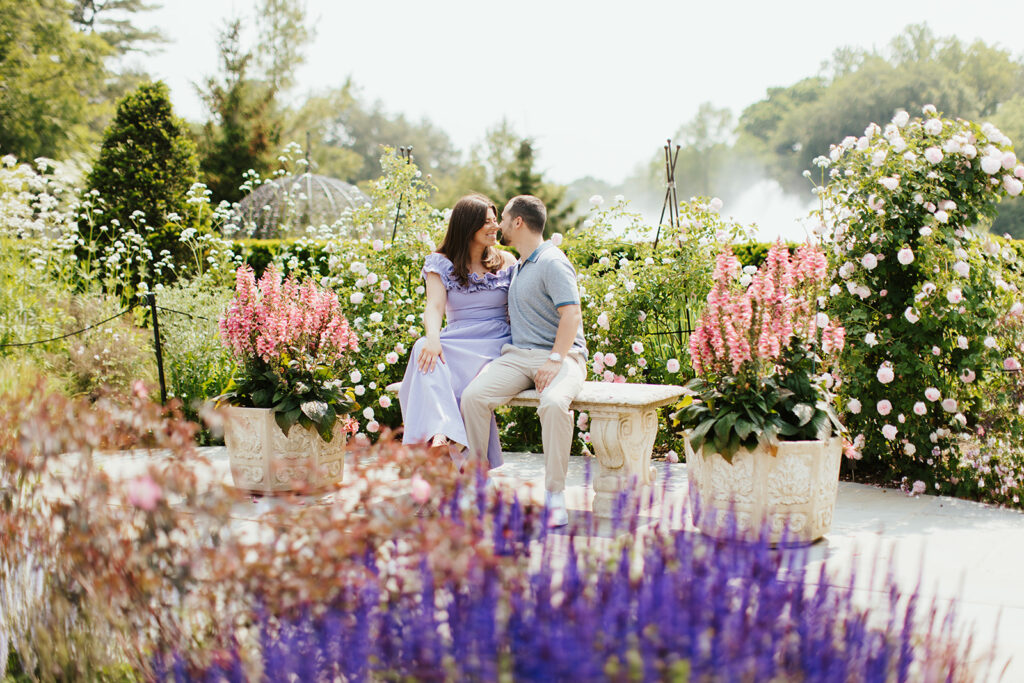 couple smiling in front of lavender flowers