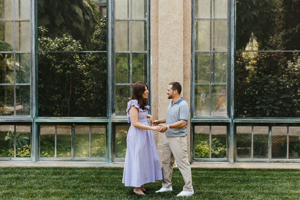 couple smiling and laughing for longwood engagement photos