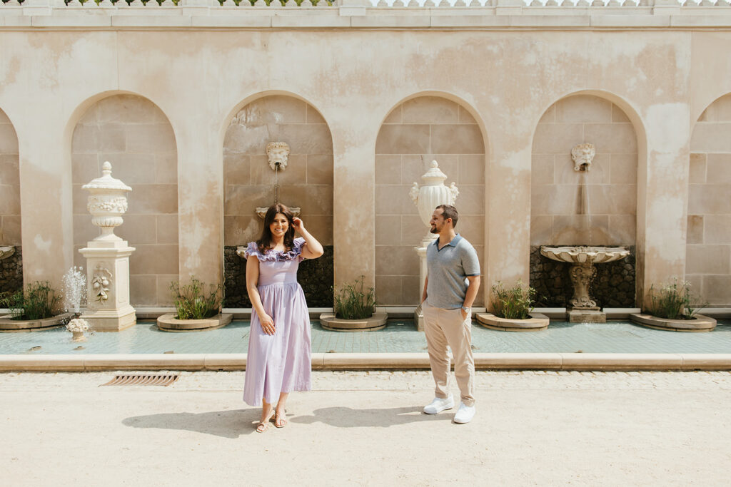 couple smiling for longwood gardens engagement photos