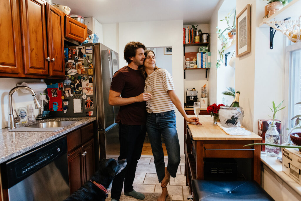 couple celebrating engagement in kitchen