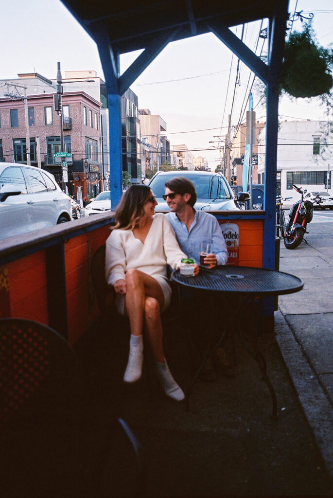 couple looking at each other and smiling film photos
