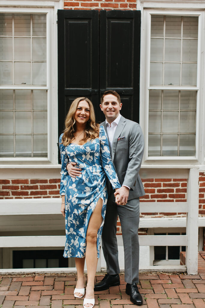 couple standing and holding hands for philly engagement pictures
