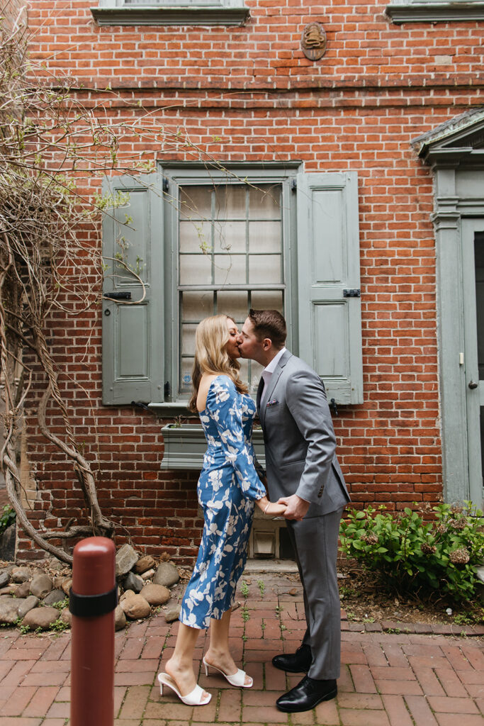 couple kissing in philly for engagement photos