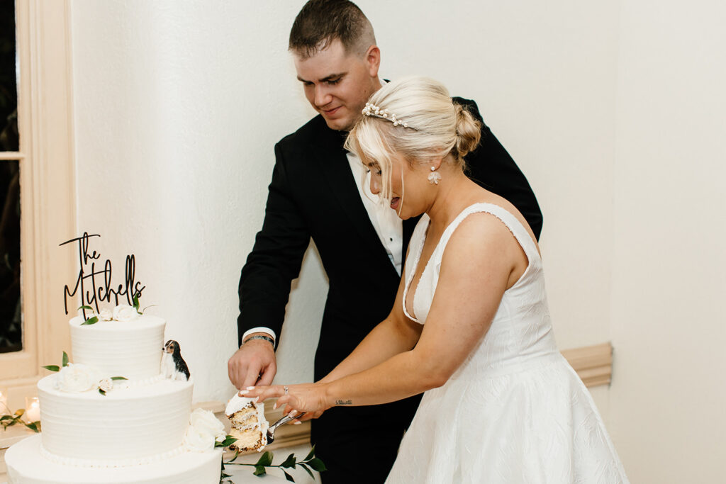 bride and groom cutting wedding cake wedding reception