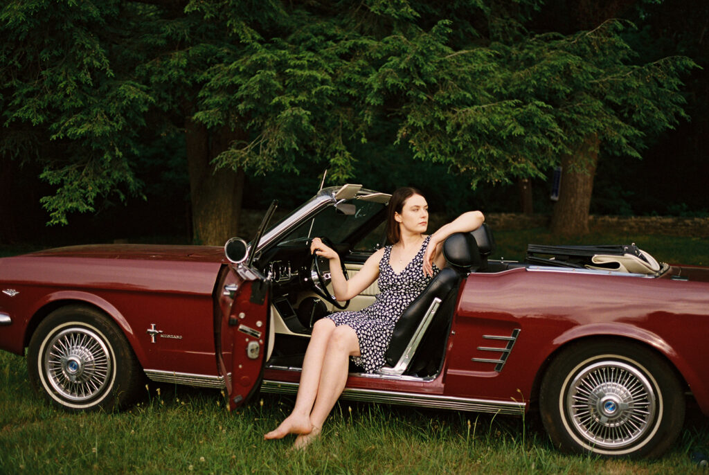 outdoor portrait session with vintage red car